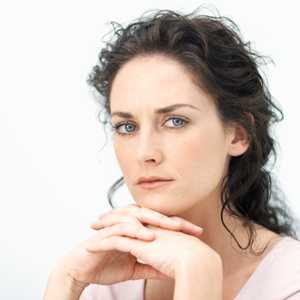 Photo: Pensive looking woman